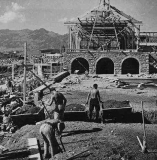 Workers Moving Dirt; Wooden Frame Construction for the Library